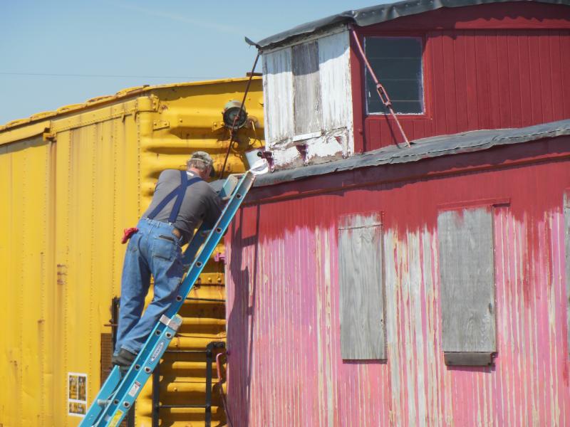 Volunteer Chuck Tuma applying paint to CB&Q 14534, May 2015