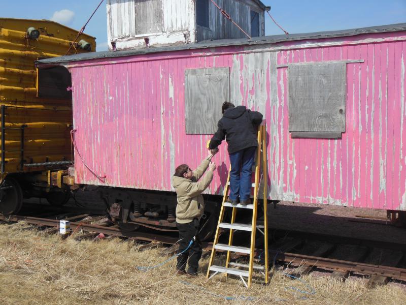 Volunteers Ron & Sue Goedken scrape paint on CB&Q 14534, April 2015
